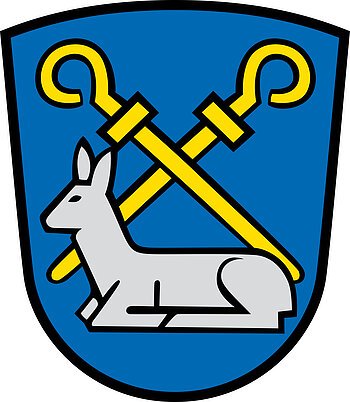 Wappen des Monheimer Ortsteils Rehau mit zwei gelben gekreuzten Abtstäben, unterhalb ein liegendes silbernes Reh auf einem blauen Hintergrund.