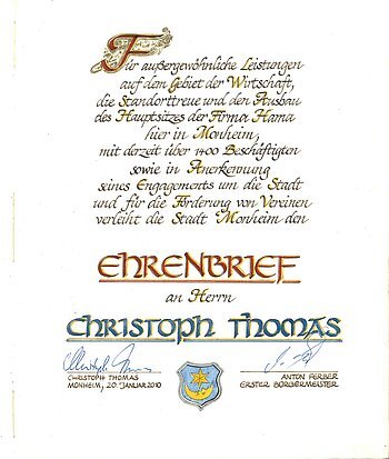 Ehrenbrief der Stadt Monheim für Christoph Thomas, unterschrieben von Christoph Thomas und Anton Ferber, aus dem Jahr 2010.