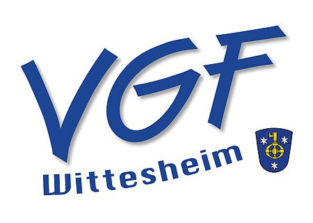 Logo mit blauen Großbuchstaben „VGF“ und darunter „Wittesheim“ rechts ein blaues Wappen mit gelbem Schlüssel und drei weißen Sternen auf weißem Hintergrund.