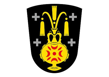 Wappen Kölburg Das Wappen des Monheimer Stadtteils Kölburg: gelber Krug auf schwarzem Hintergrund, auf dem Krug rote Muster. Links und rechts jeweils zwei graue Kreuze.