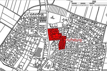 Schwarz-weiße Stadtkarte mit markiertem roten Bereich und dem Wort „Aufhebung“ in der Mitte rechts.