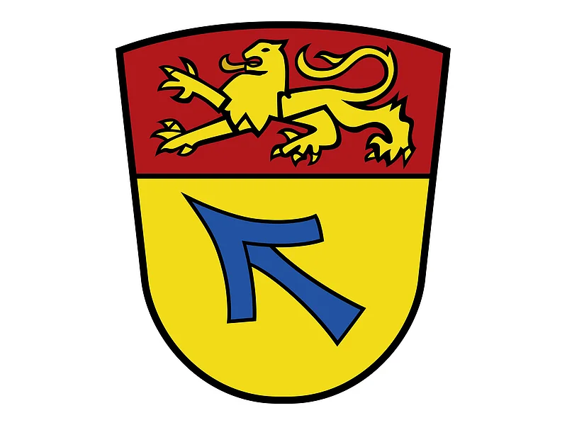 Das Wappen des Monheimer Stadtteils Weilheim. Wappen mit gelbem Löwen auf rotem Hintergrund oben und blauem Pfeil auf gelbem Hintergrund unten.