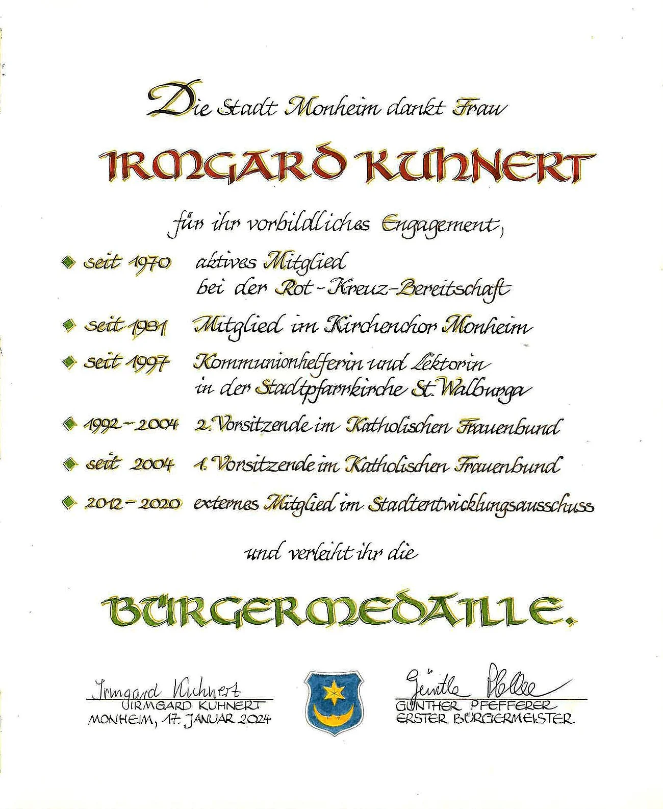 Irmgard Kuhnert Bürgermedaille Verleihung am 17. Januar 2024 Urkunde der Stadt Monheim für Irmgard Kuhnert mit Aufzählung der Tätigkeiten zu ihrem vorbildlichen Engagement und zur Verleihung der Bürgermedaille, darunter zwei Unterschriften und ein Wappen der Stadt Monheim. Datiert 17. Januar 2024.